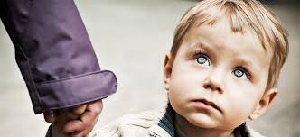Little boy holding adult